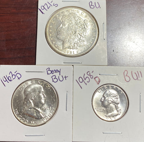 SILVER BU LOT **(3) COINS** (1) 1921 S MORGAN (1) 1963 D Benny Half Dollar (1) 1958-D BU QUARTER
